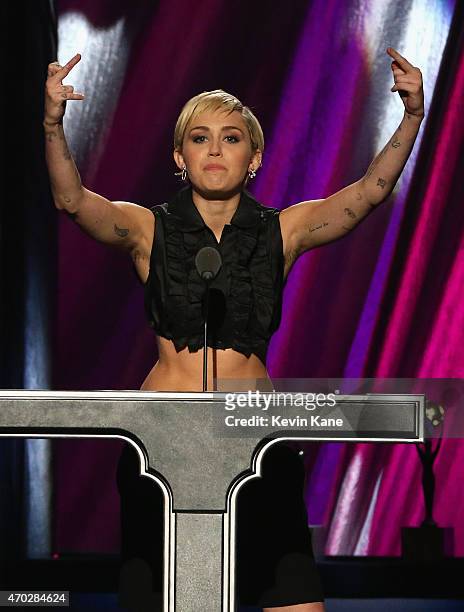 Miley Cyrus inducts Joan Jett and the Blackhearts onstage during the 30th Annual Rock And Roll Hall Of Fame Induction Ceremony at Public Hall on...