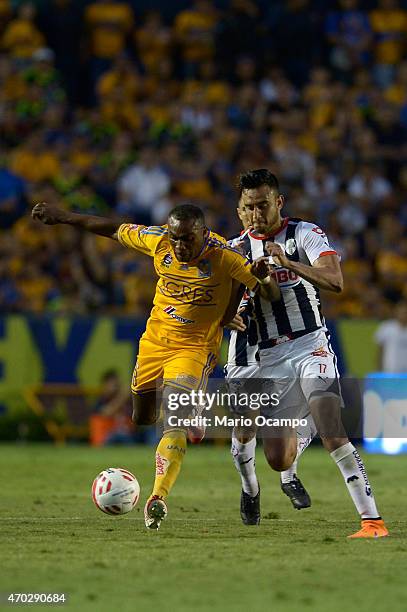 Joffre Guerron of Tigres fights for the ball with Jesus Zavala of Monterrey during a match between Tigres UANL and Monterrey as part of 14th round...