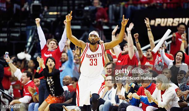 Corey Brewer of the Houston Rockets reacts to a three-point shot against the Dallas Mavericks during Game One in the Western Conference Quarterfinals...