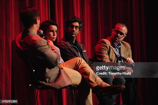 Scott Foundas, actor Noah Lomax, director Ramin Bahrani and Brian Tallerico speak onstage at the '99 HOMES' Screening during EBERTFEST 2015 at...
