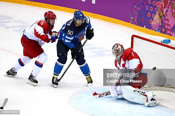 Juhamatti Aaltonen of Finland scores a first-period goal against Semyon Varlamov of Russia as Nikita Nikitin of Russia defends during the Men's Ice...