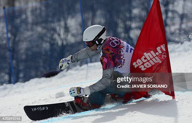 Slovenia's Rok Flander competes in the Men's Snowboard Parallel Giant Slalom 1/8 Finals at the Rosa Khutor Extreme Park during the Sochi Winter...