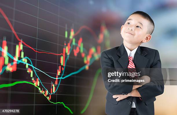 young business boy - children looking graph stock pictures, royalty-free photos & images