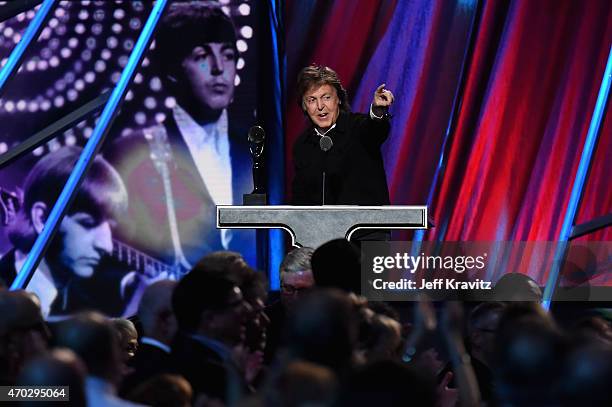 Sir Paul McCartney inducts Ringo Starr onstage during the 30th Annual Rock And Roll Hall Of Fame Induction Ceremony at Public Hall on April 18, 2015...