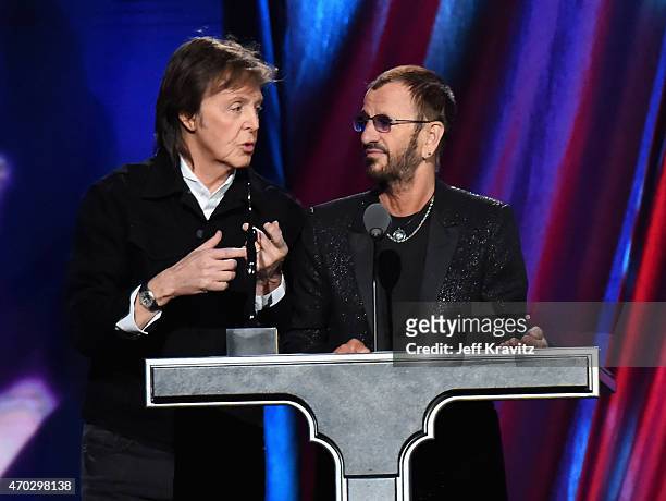 Sir Paul McCartney and inductee Ring Starr speak onstage during the 30th Annual Rock And Roll Hall Of Fame Induction Ceremony at Public Hall on April...