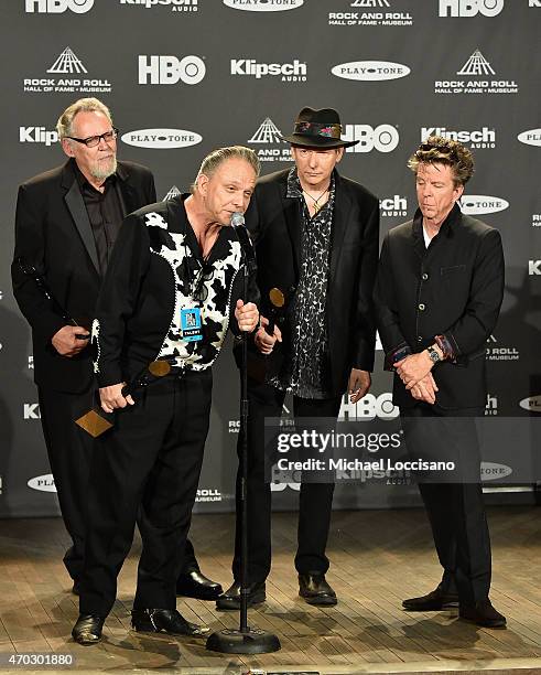 Jimmie Vaughan and inductees Reese Wynans, Tommy Shannon and Chris Layton of Stevie Ray Vaughan and Double Trouble speak in the press room during the...