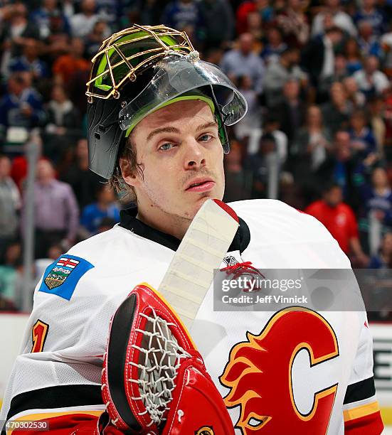 Jonas Hiller of the Calgary Flames looks on from the bench during Game Two of the Western Conference Quarterfinals against the Vancouver Canucks...