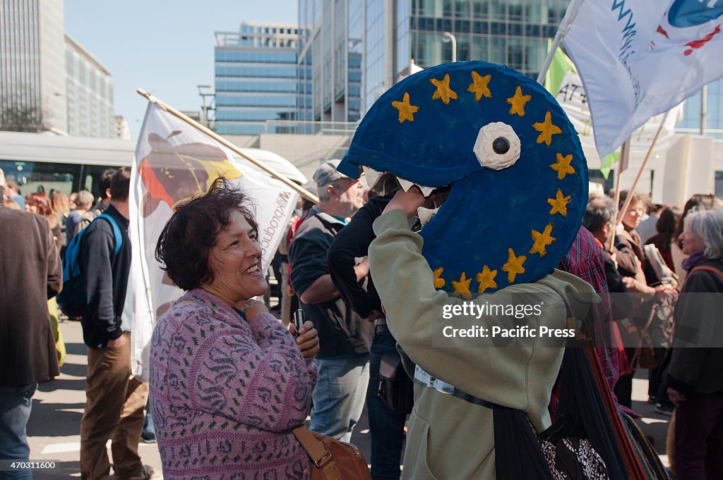 A protester with a pacman head with the European flag on it...