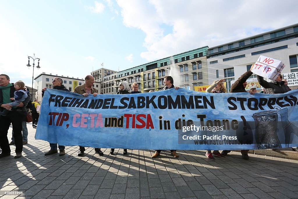 Activists create a protest chain between Potsdamer Platz...