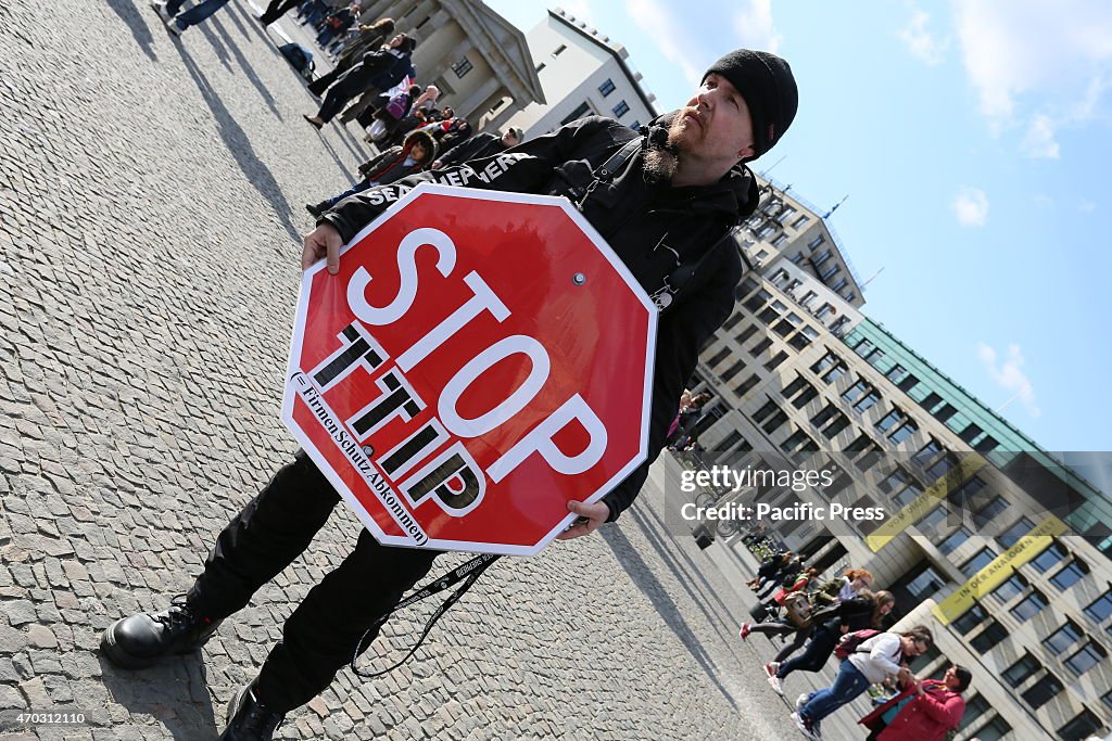 Activists create a protest chain between Potsdamer Platz...