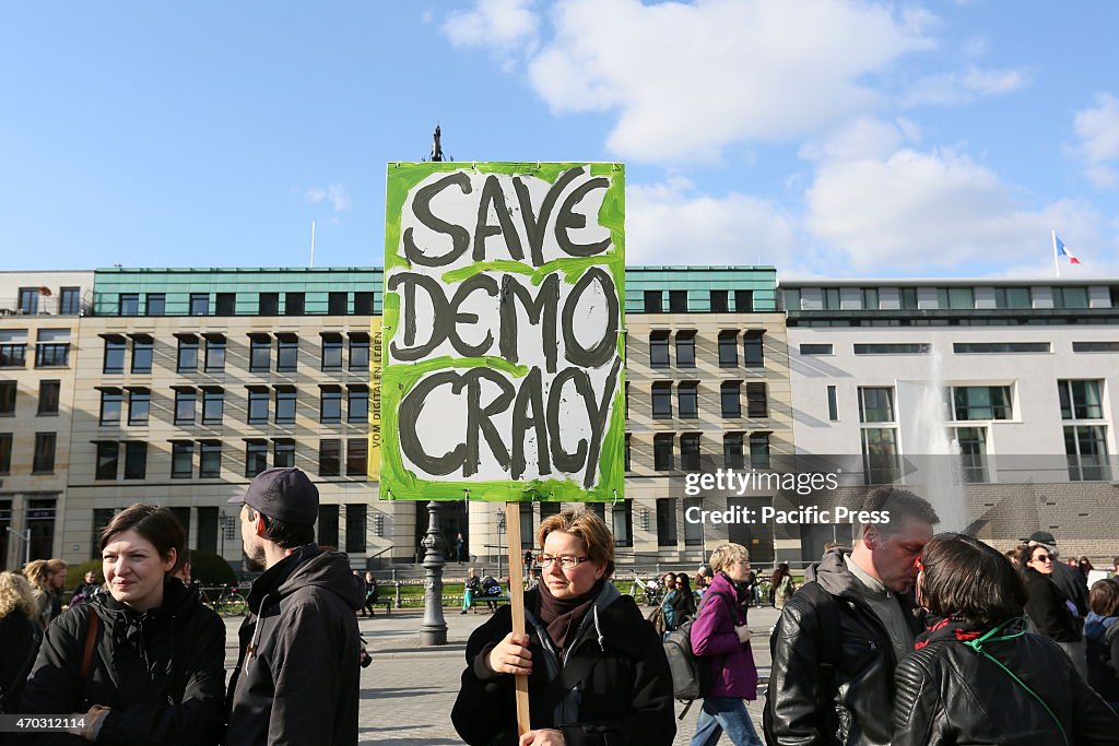 Activists create a protest chain between Potsdamer Platz...