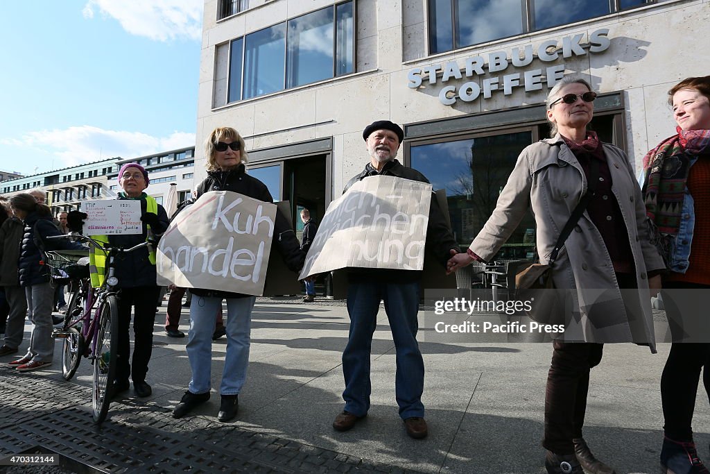 Activists create a protest chain between Potsdamer Platz...