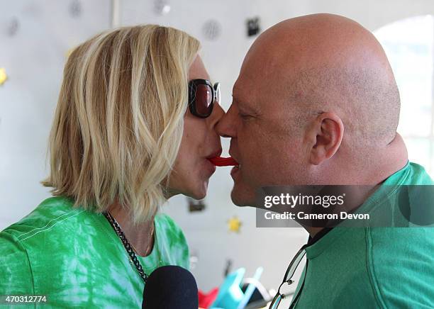 Actor Michael Chiklis and his wife complete the Twizzler Challenge at the 13th Annual Los Angeles Walk Now for Autism Speaks at Rose Bowl on April...