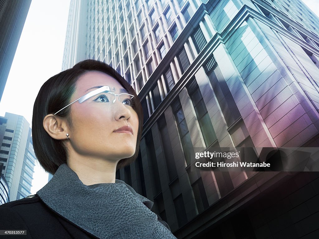 Businesswoman wearing a PC with head-mounted displ