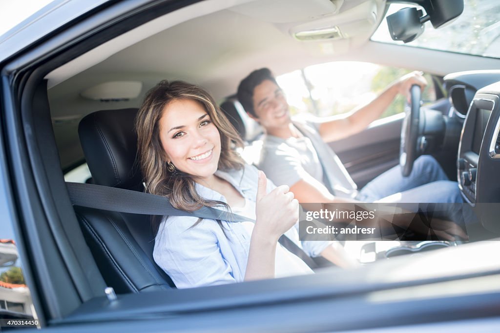 Happy couple going on a road trip