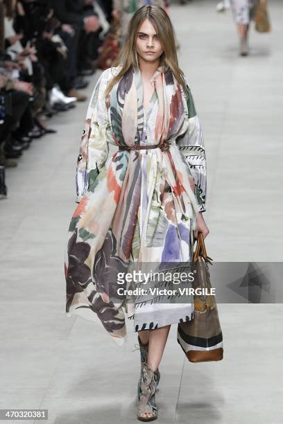 Cara Delevigne walks the runway at the Burberry Prorsum Ready to Wear Fall/Winter 2014-2015 show at London Fashion Week AW14 at Perks Fields,...
