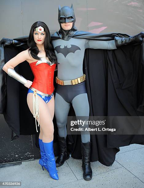 Cosplayers Leslie Yohnka and Dakotah Luster dressed as Wonder Woman and Batman at the Warner Bros. And DC Comics Super Hero World Record Event held...