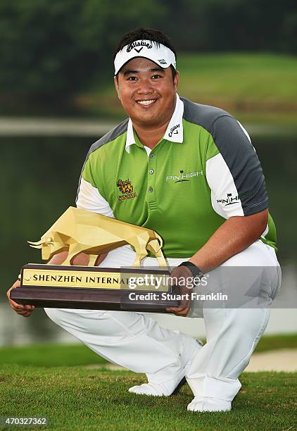 Kiradech Aphibarnrat of Thailand holds the trophy after winning the Shenzhen International at Genzon Golf Club on April 19, 2015 in Shenzhen, China.