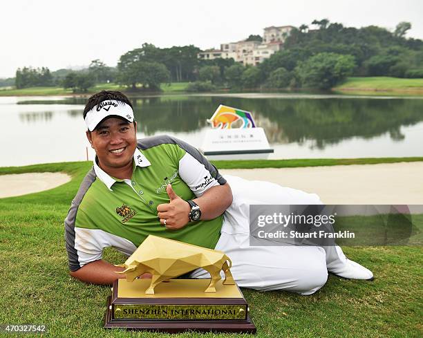 Kiradech Aphibarnrat of Thailand with the trophy after winning the Shenzhen International at Genzon Golf Club on April 19, 2015 in Shenzhen, China.