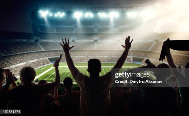 american football fans at stadium - american football stadium stock pictures, royalty-free photos & images