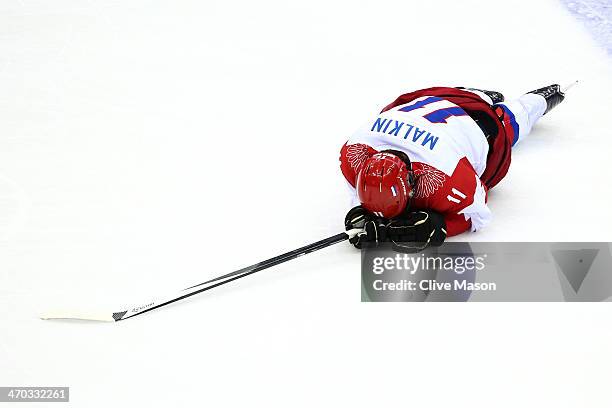 Yevgeni Malkin of Russia falls to the ice after colliding with Mikael Granlund of Finland during the Men's Ice Hockey Quarterfinal Playoff on Day 12...