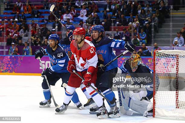 Alexander Radulov of Russia fights for position in front of the net with Kimmo Timonen, Sami Vatanen and Tuukka Rask of Finland during the Men's Ice...