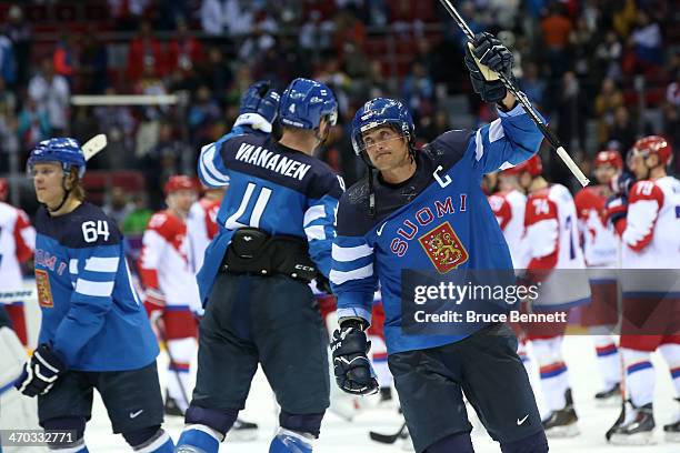 Mikael Granlund, Ossi Vaananen and Teemu Selanne of Finland celebrate after defeating Russia 3-1 during the Men's Ice Hockey Quarterfinal Playoff on...