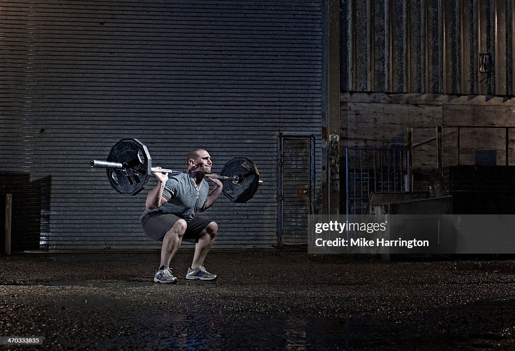 Strong Male Attempting to Lift Barbell