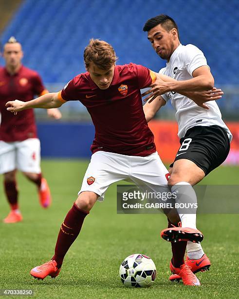 Roma's forward from Serbia Adem Ljajic vies with Atalanta's midfielder Giulio Migliaccio during the Italian Serie A football match between AS Roma...