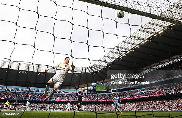 Adrian of West Ham watches as James collins of West Ham scores an own goal during the Barclays Premier League match between Manchester City and West...