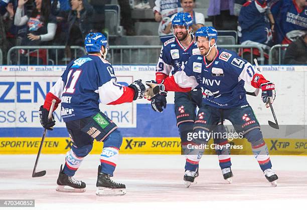 Andrew Joudrey, Danny Richmond and Christoph Ullmann of the Adler Mannheim celebrate after scoring the 2:0 during the game between Adler Mannheim and...