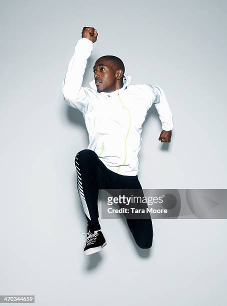 sports man jumping - sportswear stock pictures, royalty-free photos & images