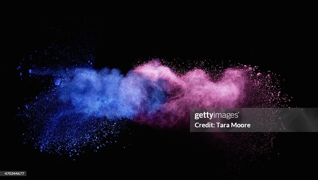 Blue and pink smoke colliding