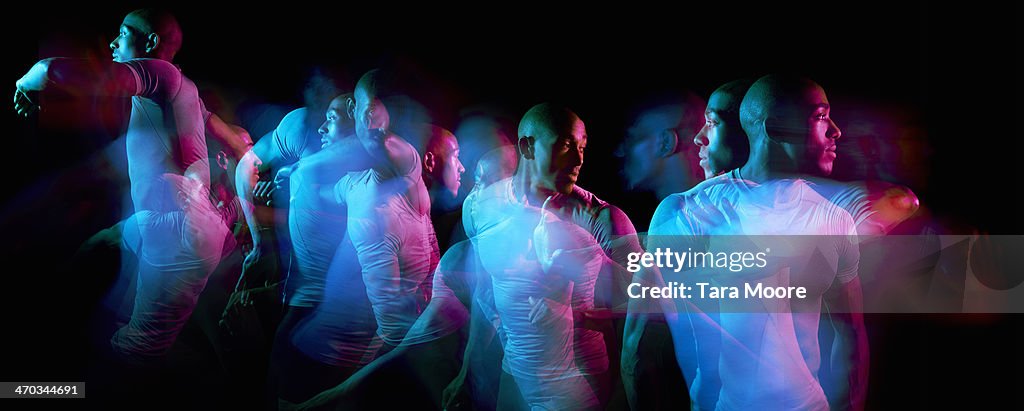 Multiple exposure of sports man moving