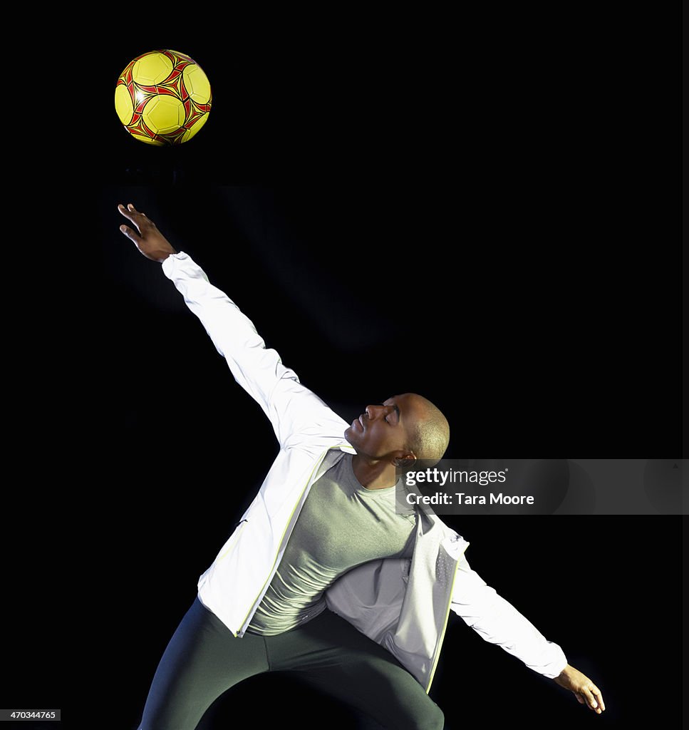 Man flicking ball in air