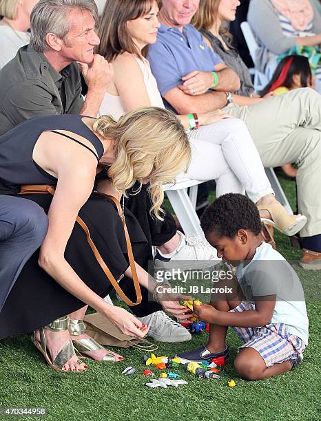 Charlize Theron, Jackson Theron and Sean Penn attend the generationOn West Coast Block Party on April 18, 2015 in Beverly Hills, California.