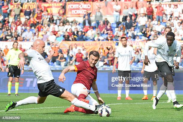 Roma player Vasilis Torosidis is challenged by Giulio Migliaccio during the Serie A match between AS Roma and Atalanta BC at Stadio Olimpico on April...