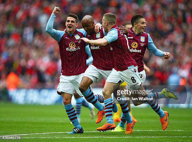 Fabian Delph of Aston Villa celebrates scoring their second with Ashley Westwood, Tom Cleverley of Aston Villa during the FA Cup Semi Final between...