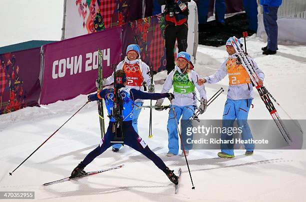 Gold medalists Tora Berger of Norway, Tiril Eckhoff of Norway, Ole Einar Bjoerndalen of Norway and Emil Hegle Svendsen of Norway celebrate after the...