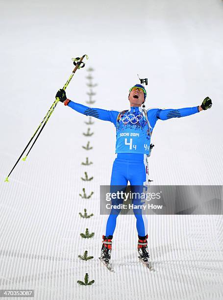 Lukas Hofer of Italy celebrates winning bronze in the 2 x 6 km Women + 2 x 7 km Men Mixed Relay during day 12 of the Sochi 2014 Winter Olympics at...