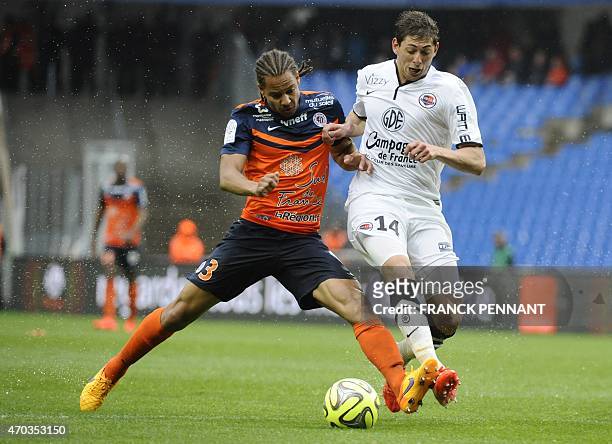 Caen's Argentinian forward Emiliano Sala vies with Montpellier's French defender Daniel Congre during the French L1 football match between...