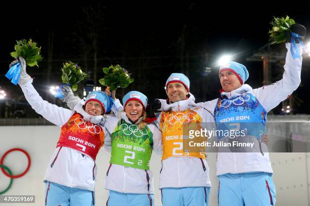 Gold medalists Tora Berger of Norway, Tiril Eckhoff of Norway, Ole Einar Bjoerndalen of Norway and Emil Hegle Svendsen of Norway celebrate during the...