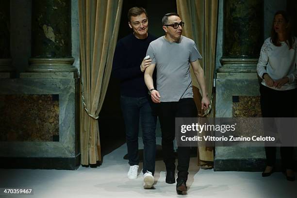 Designers Tommaso Aquilano and Roberto Rimondi acknowledge the applause of the audience after the Fay Show during Milan Fashion Week Womenswear...