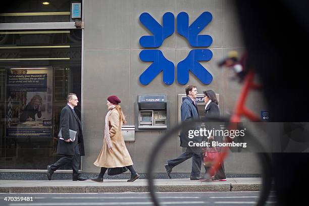 Logo sits above an automated teller machine outside a Royal Bank of Scotland Group Plc bank branch in London, U.K., on Wednesday, Feb. 19, 2014....