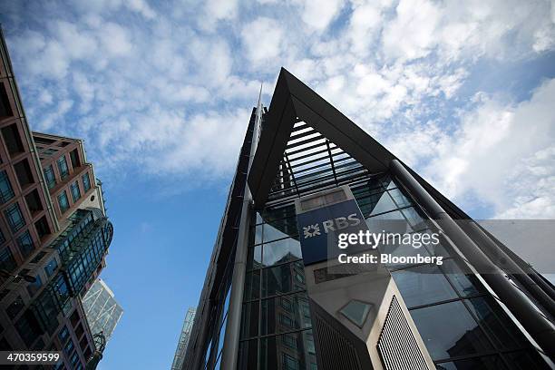 Logo sits on a sign outside Royal Bank of Scotland Group Plc's headquarters in London, U.K., on Wednesday, Feb. 19, 2014. Royal Bank of Scotland...