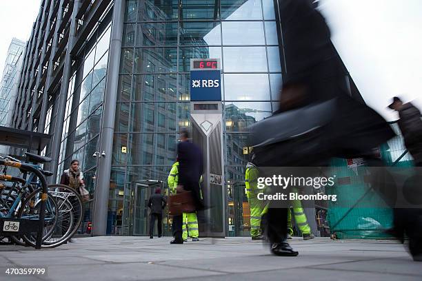 Pedestrians pass the Royal Bank of Scotland Group Plc's headquarters in this image taken with a tilt-shift lens in London, U.K., on Wednesday, Feb....