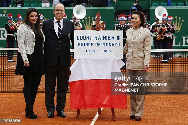 Prince Albert II of Monaco , his cousin Elisabeth-Anne de Massy and her daughter Melanie-Antoinette de Massy pose during the inauguration of "Court...