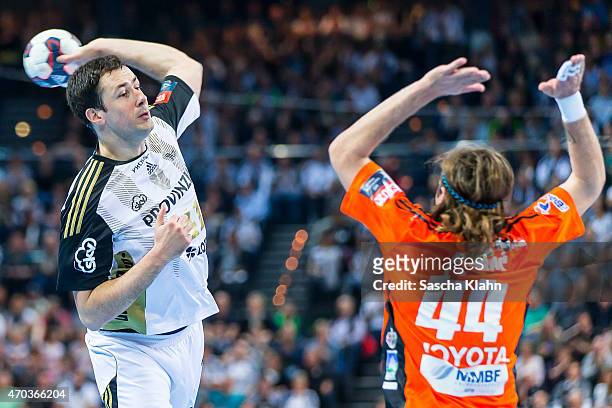 Marco Vujin of Kiel challenges Dean Bombay of Szeged during the VELUX EHF Champions League Quarter Final between THW Kiel and Pick Szeged at...