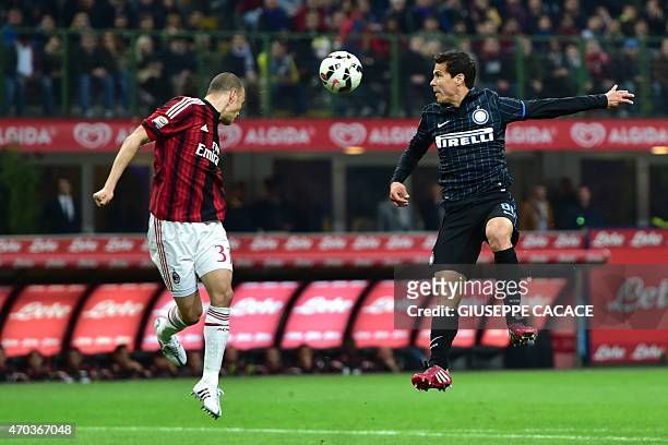 Milan's defender from Brazil Alex Rodrigo Dias da Costa fights for the ball with Inter Milan's midfielder from Brazil Hernanes during the Italian...