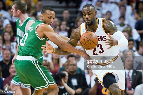 Avery Bradley of the Boston Celtics fights for a loose ball with LeBron James of the Cleveland Cavaliers in the first half during Game One in the...